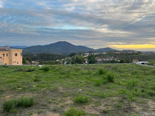 a view of an house with a big yard