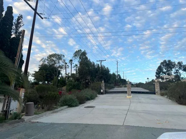 a view of backyard with plants and outdoor seating
