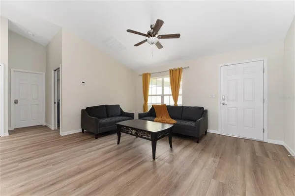 a living room with furniture and a window