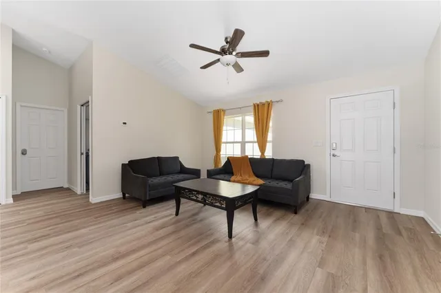 a living room with furniture and a window