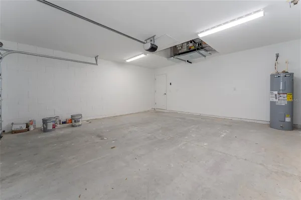 an empty room with projector & cabinets