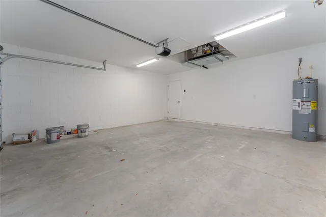 an empty room with projector & cabinets