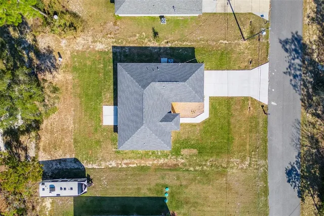 an aerial view of a house with a swimming pool