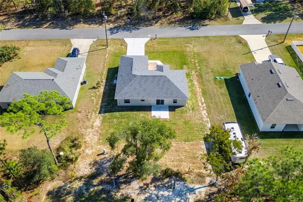 an aerial view of a house with a swimming pool