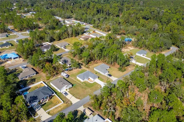 an aerial view of residential house with outdoor space