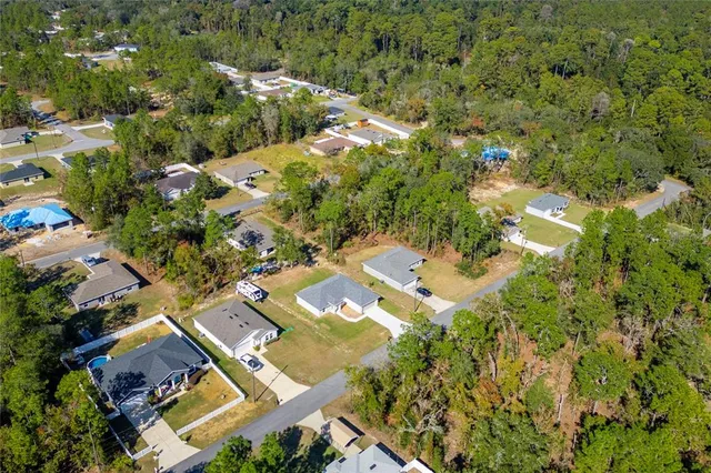 an aerial view of residential house with outdoor space
