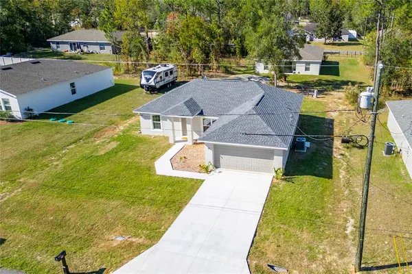 a aerial view of a house with swimming pool