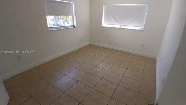 an empty room with windows