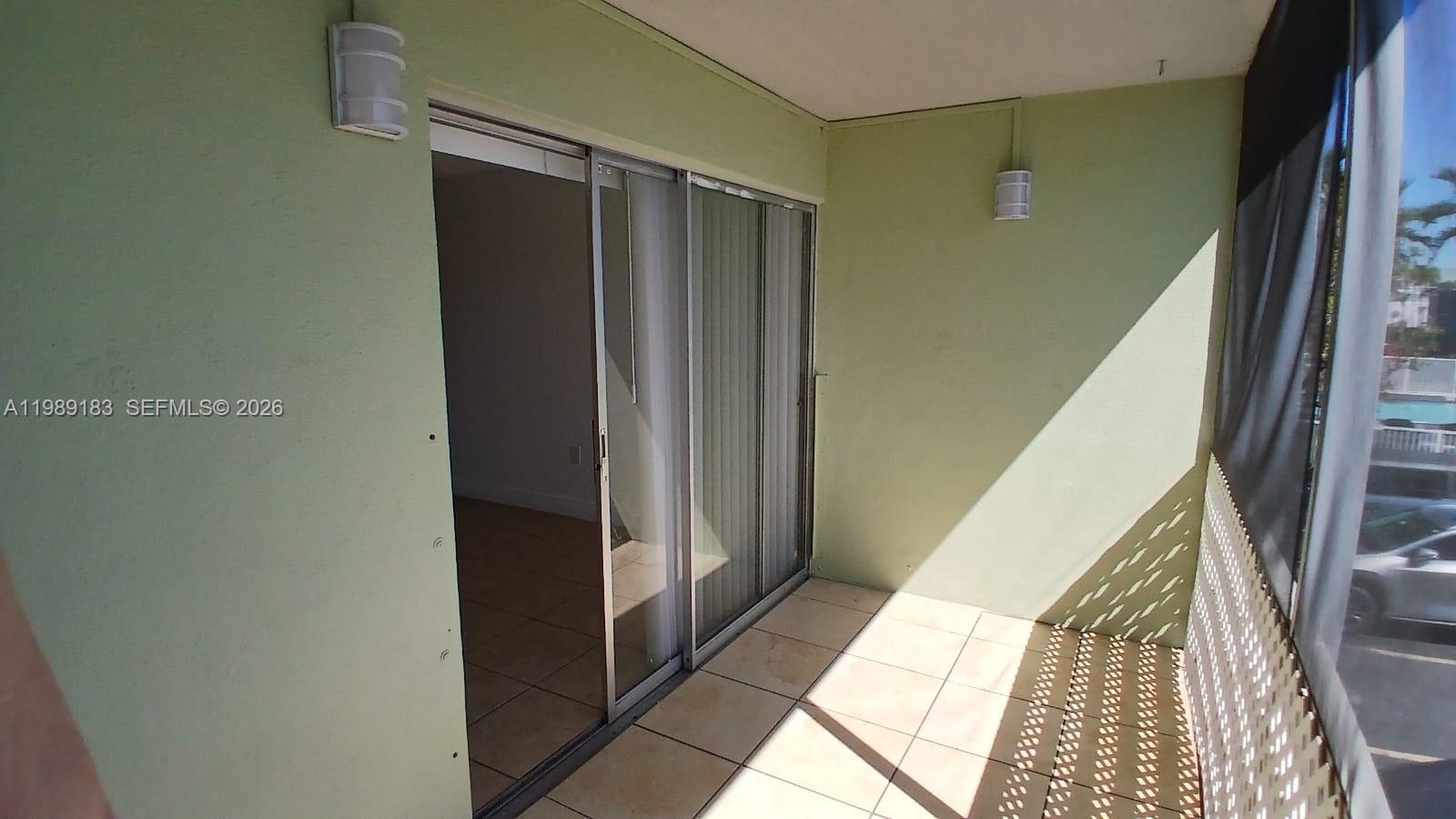 8782 Southwest 12th Street, Unit 208 Miami, FL 33174 - Photo 5 of 16 a view of hallway with stairs and wooden floor