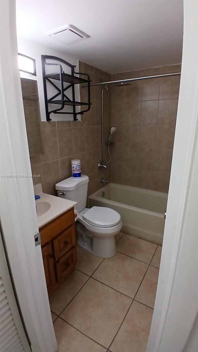 8782 Southwest 12th Street, Unit 208 Miami, FL 33174 - Photo 8 of 16 a bathroom with a toilet and a shower