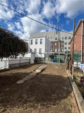 a view of a building with sitting area