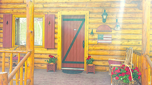 6210 Mountain View Road, Unit 133 Coalville, UT 84017 - Photo 10 of 87 Front door and covered porch. The covered 2 story deck extends to the east and south side of the cabin.