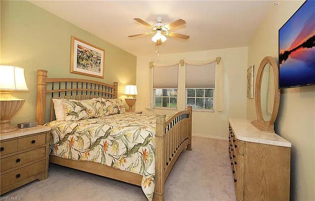 a bed room with a bed and a window