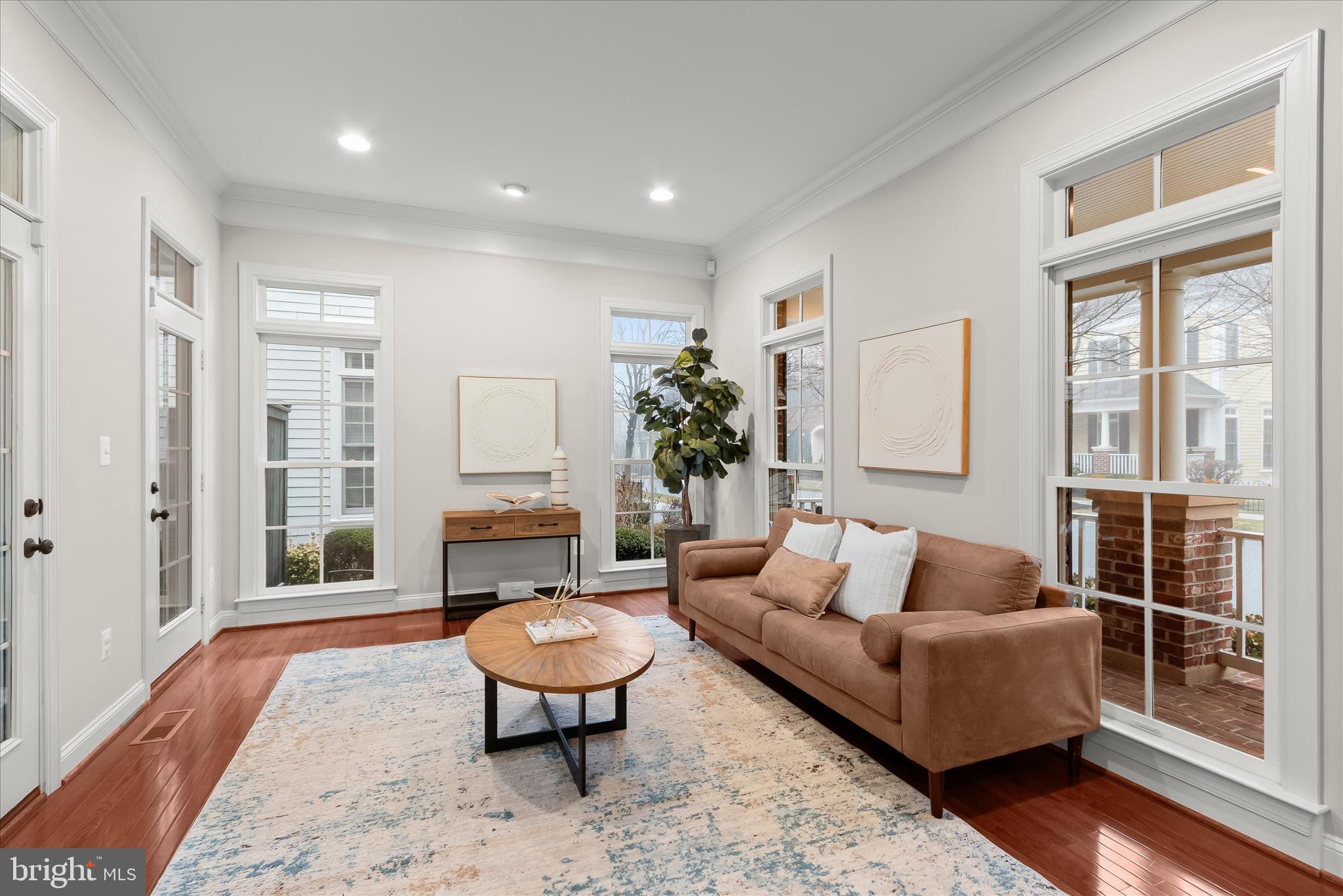 7650 Midtown Road Fulton, MD 20759 - Photo 11 of 76 a living room with furniture a wooden floor and a fireplace