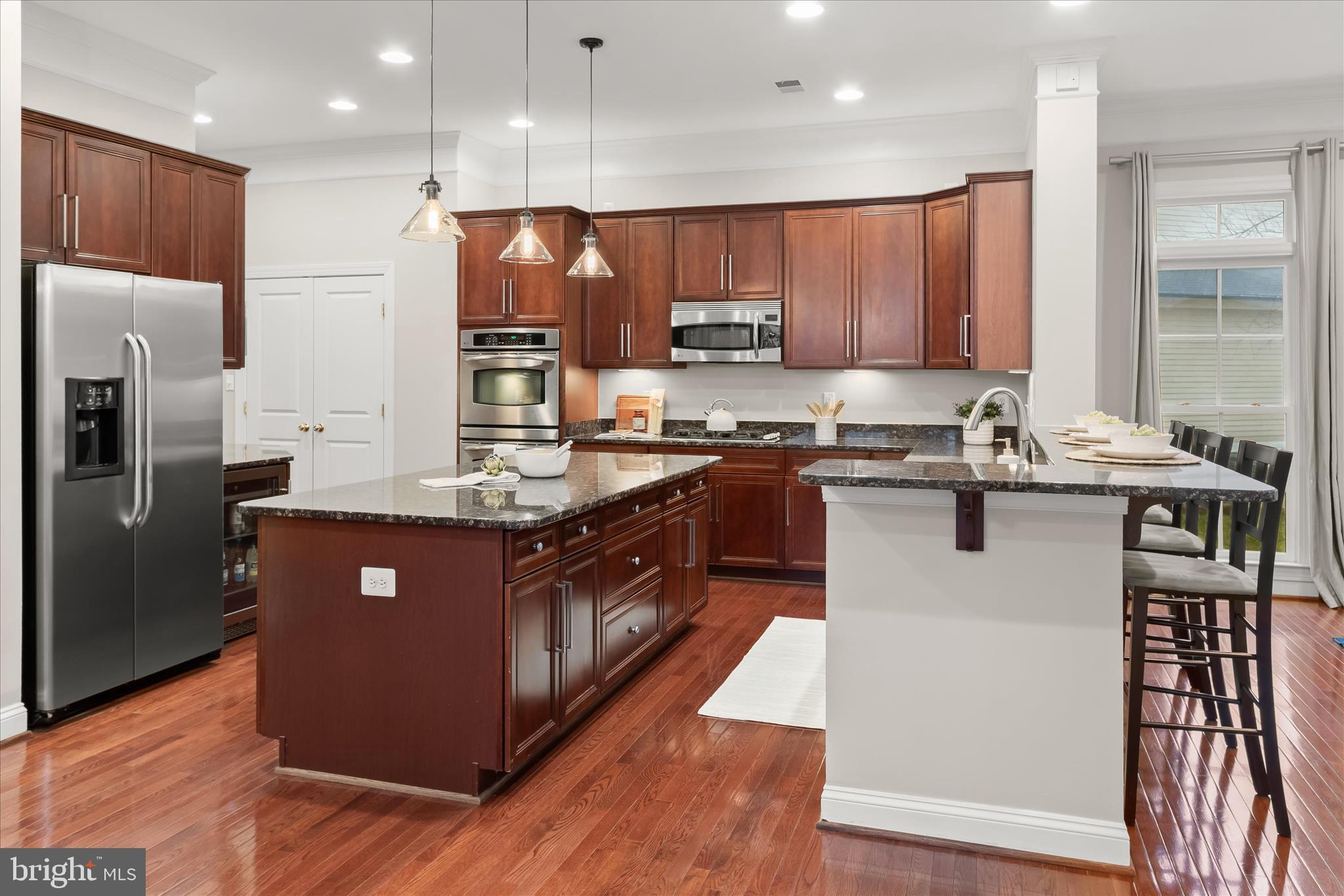7650 Midtown Road Fulton, MD 20759 - Photo 19 of 76 a kitchen with stainless steel appliances granite countertop a stove a sink dishwasher a refrigerator and a oven with wooden floor