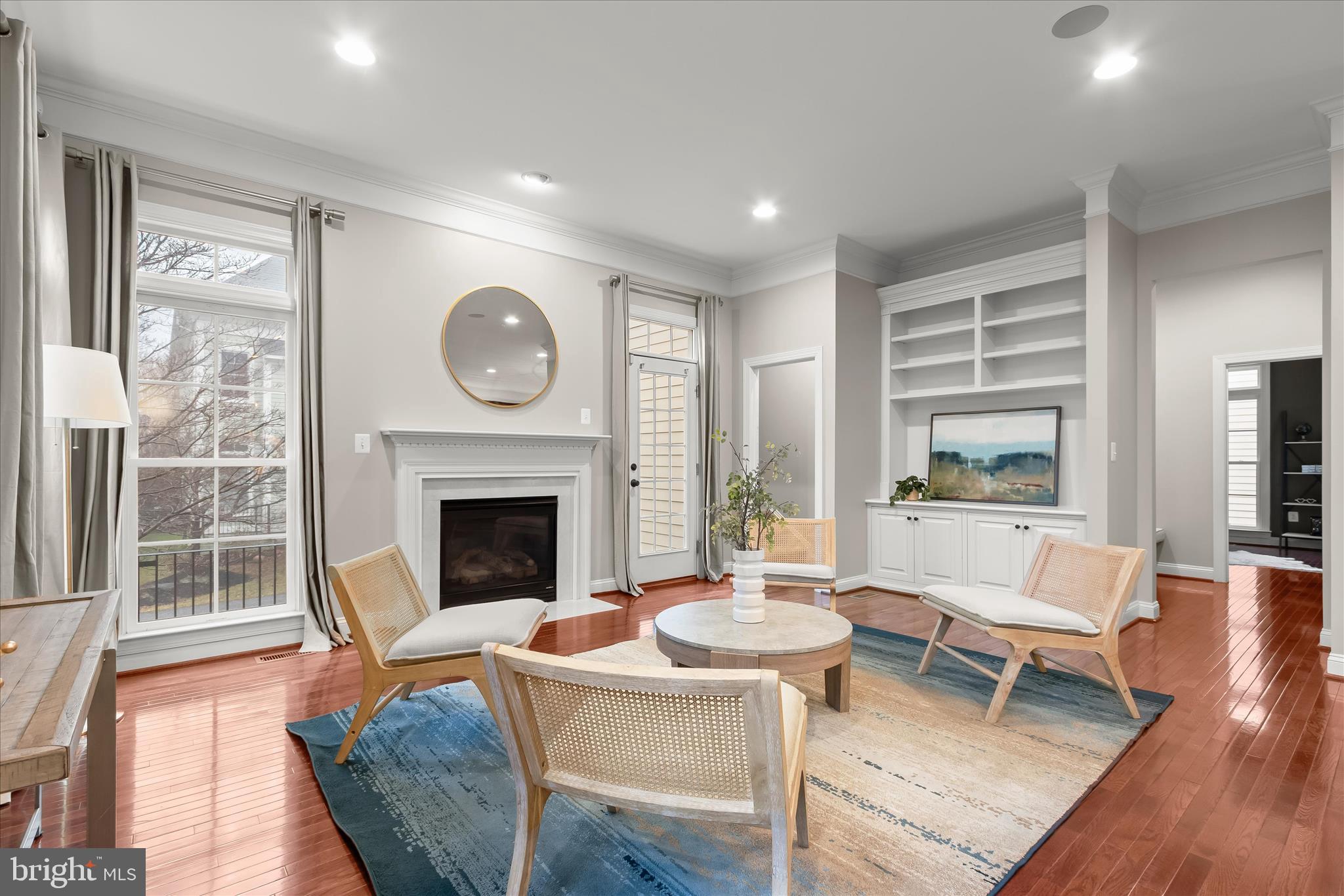 7650 Midtown Road Fulton, MD 20759 - Photo 28 of 76 a living room with furniture a fireplace and a large window
