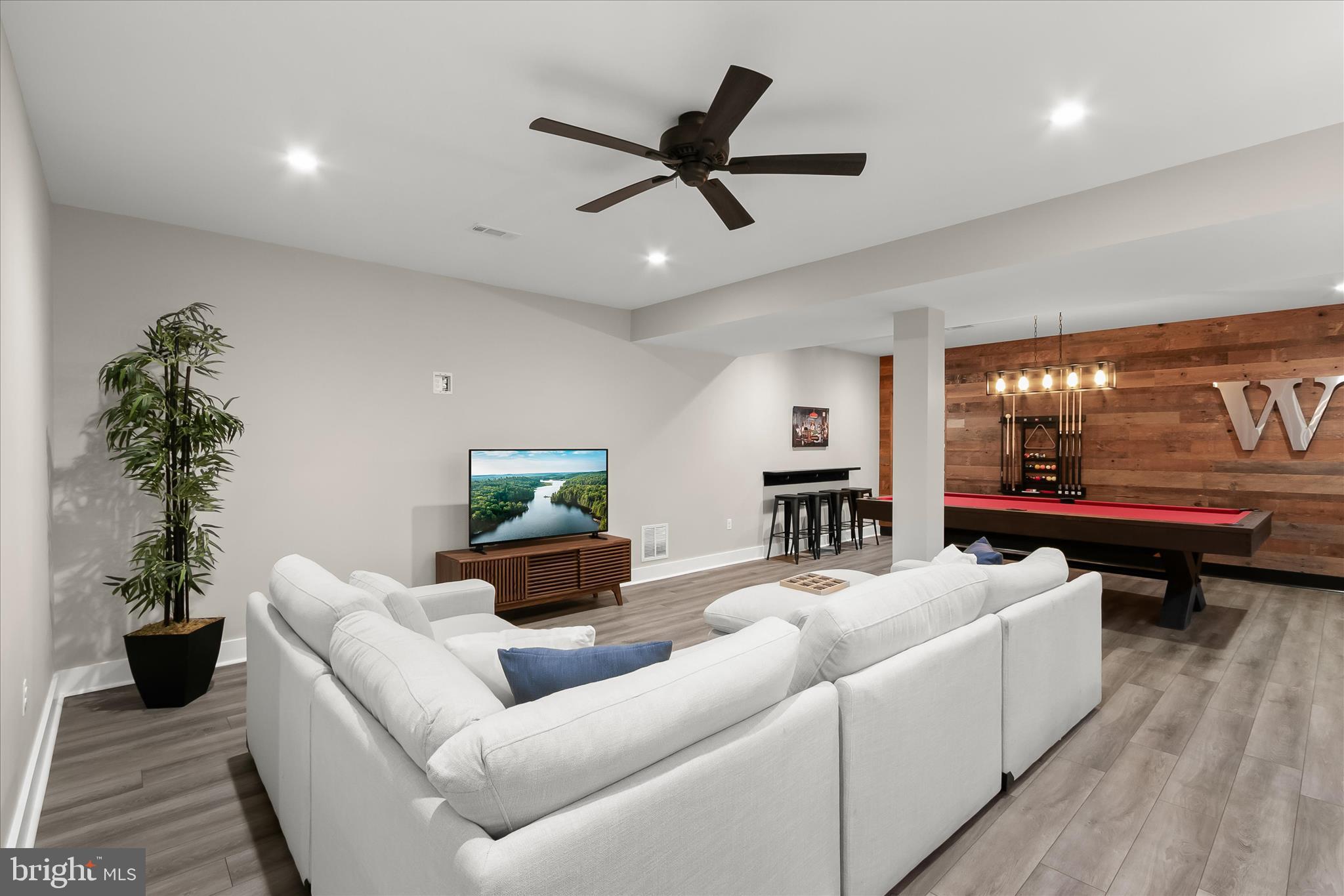 7650 Midtown Road Fulton, MD 20759 - Photo 35 of 76 a living room with furniture and a flat screen tv