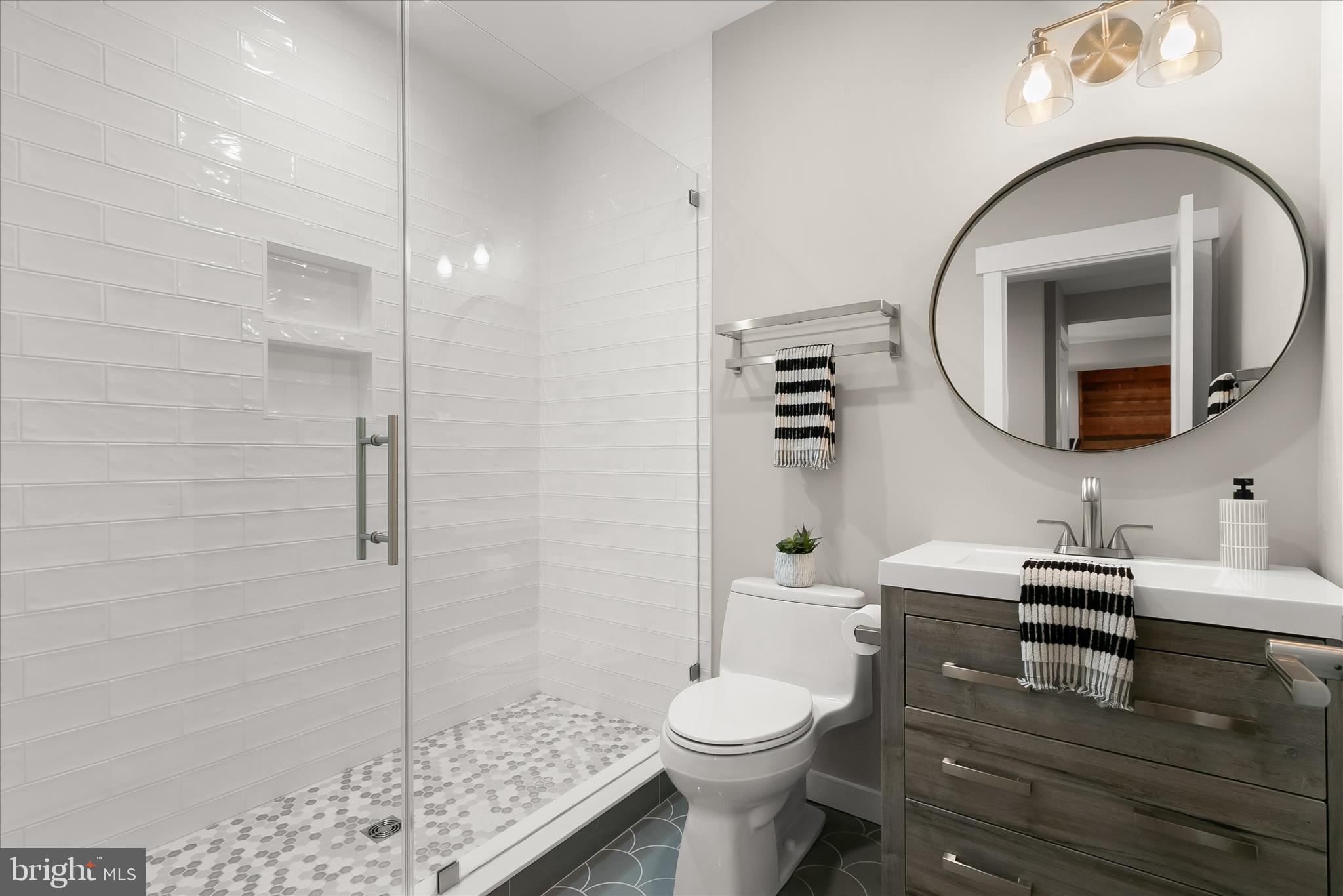 7650 Midtown Road Fulton, MD 20759 - Photo 43 of 76 a bathroom with a toilet a sink and shower