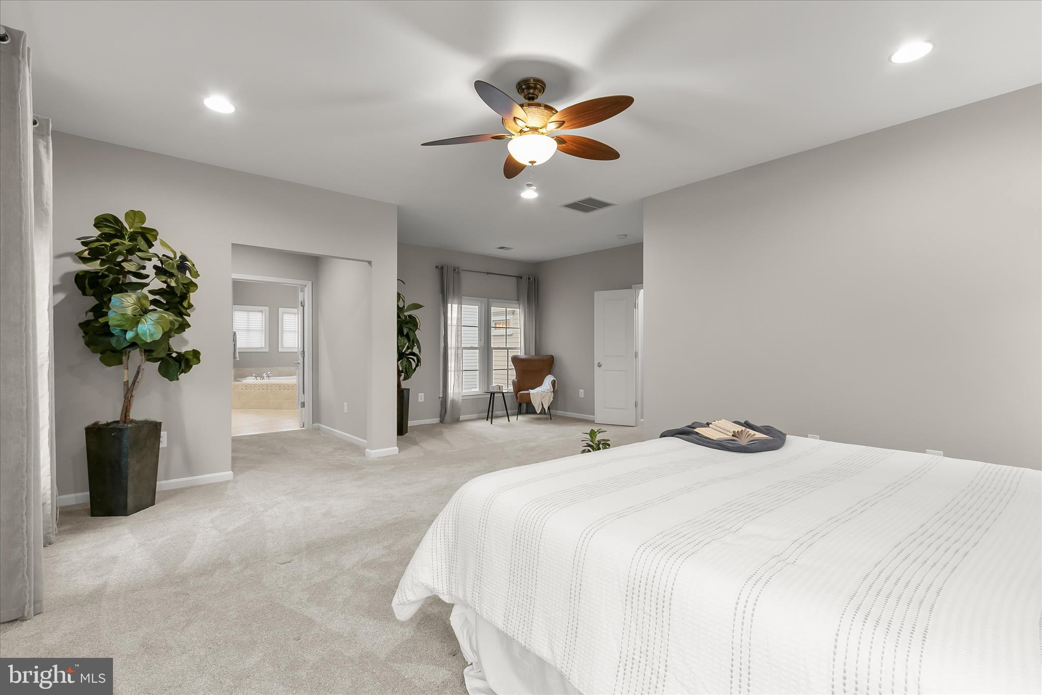 7650 Midtown Road Fulton, MD 20759 - Photo 49 of 76 a bedroom with a bed and a chandelier