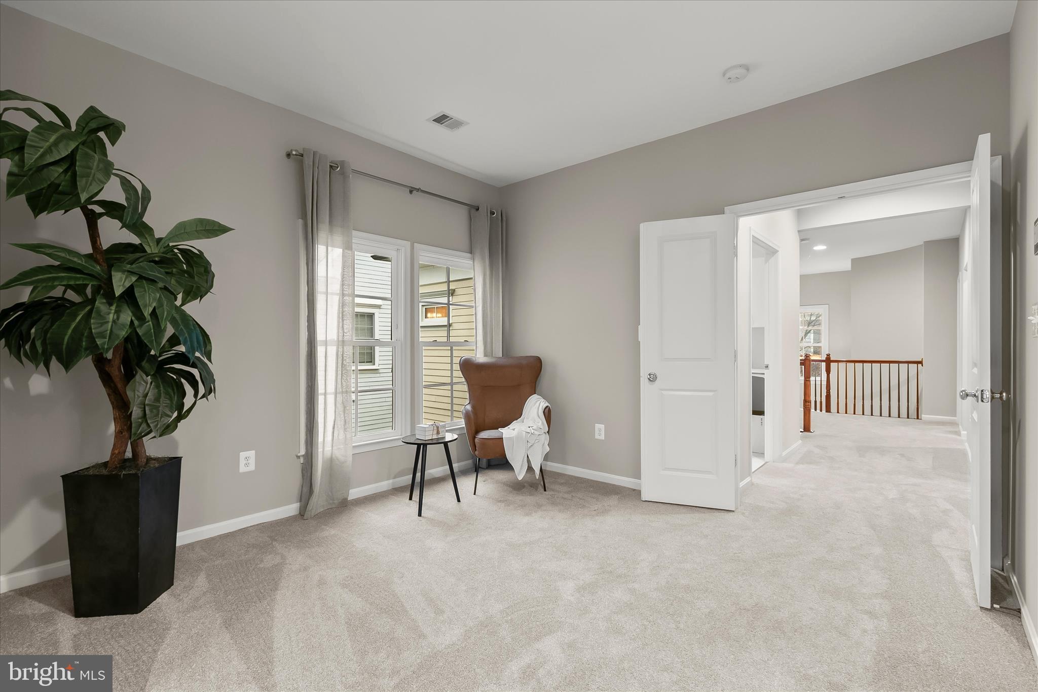 7650 Midtown Road Fulton, MD 20759 - Photo 51 of 76 a living room with furniture and a potted plant