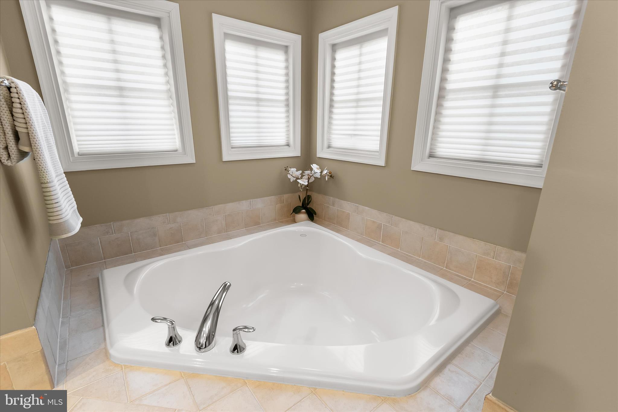 7650 Midtown Road Fulton, MD 20759 - Photo 54 of 76 a white bath tub sitting in a bathroom next to a window