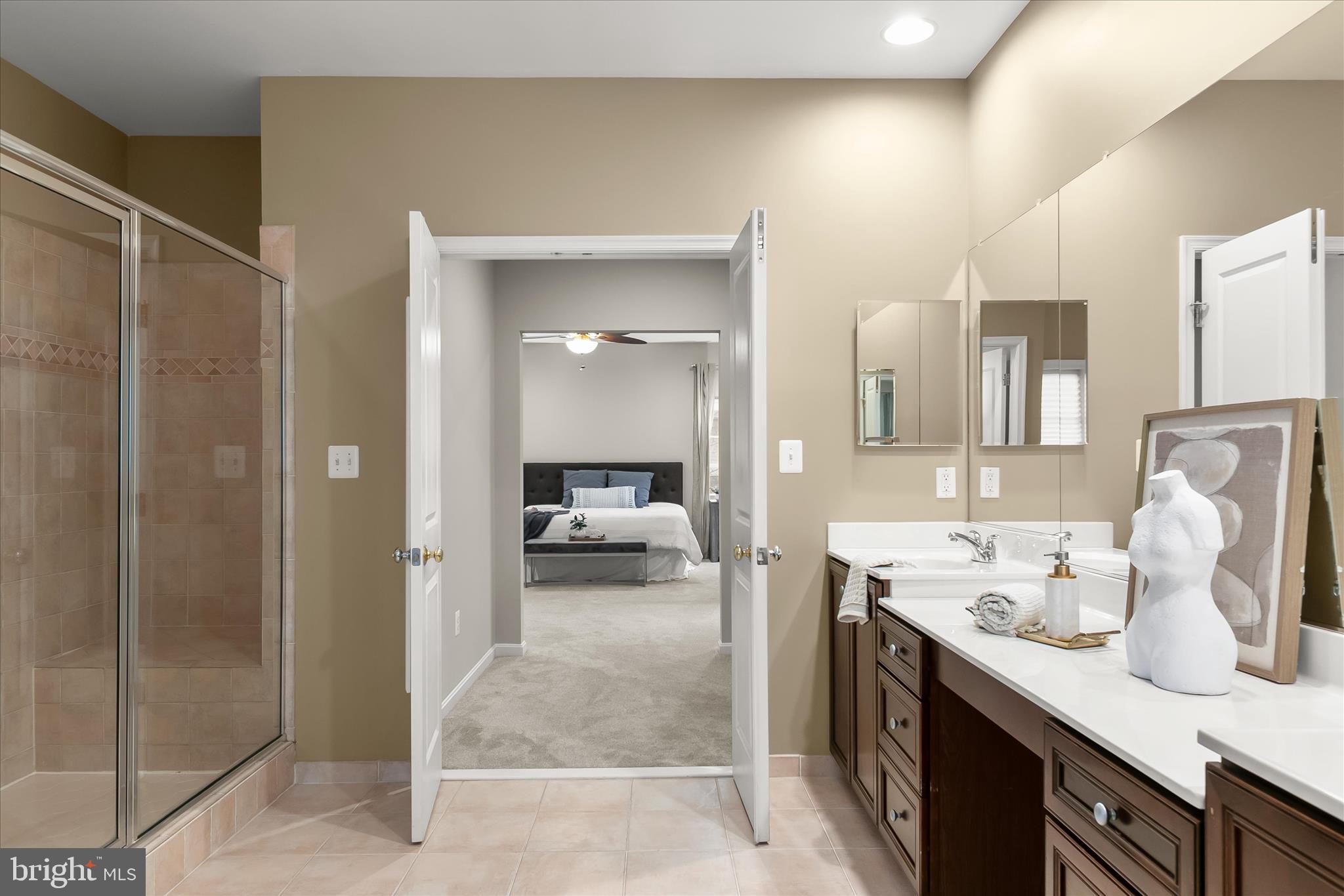 7650 Midtown Road Fulton, MD 20759 - Photo 55 of 76 a en suite bathroom with a granite countertop sink and a mirror