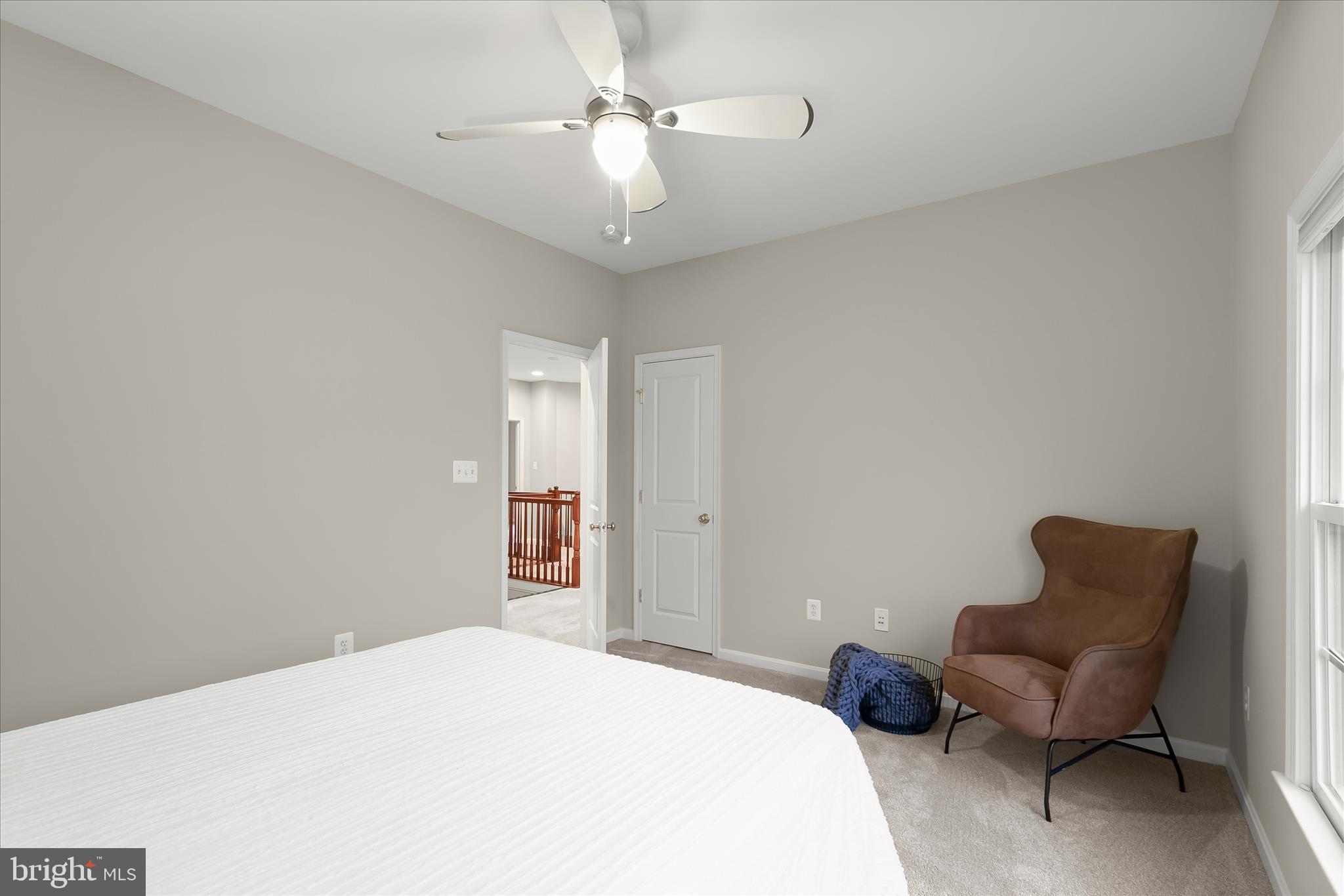 7650 Midtown Road Fulton, MD 20759 - Photo 57 of 76 a bedroom with a bed and a couch