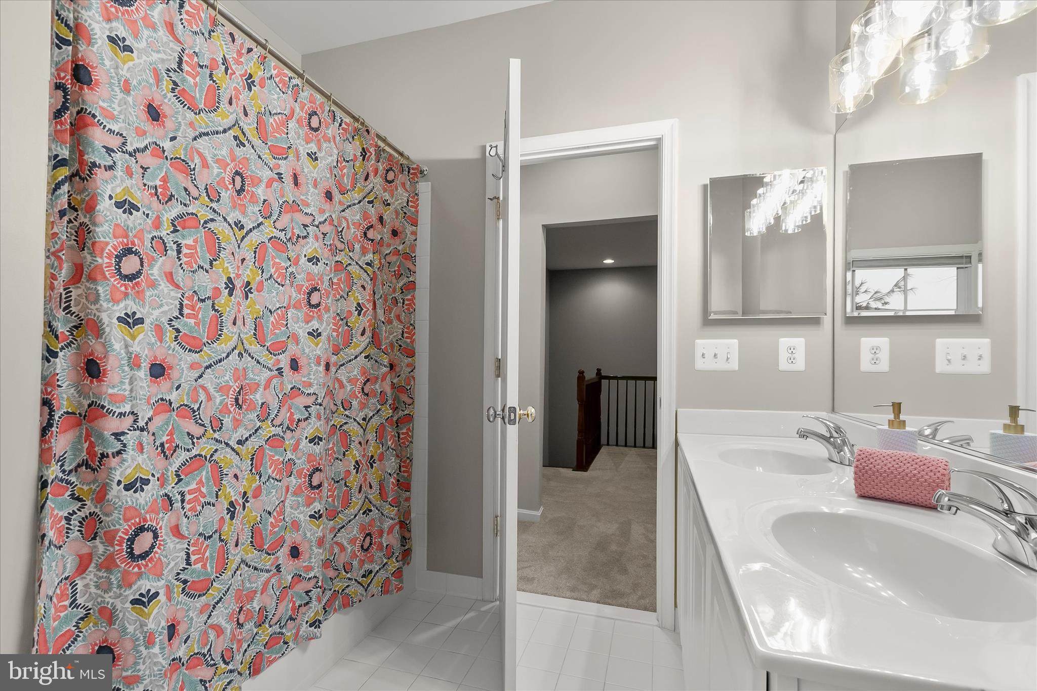 7650 Midtown Road Fulton, MD 20759 - Photo 58 of 76 a bathroom with a sink and a mirror