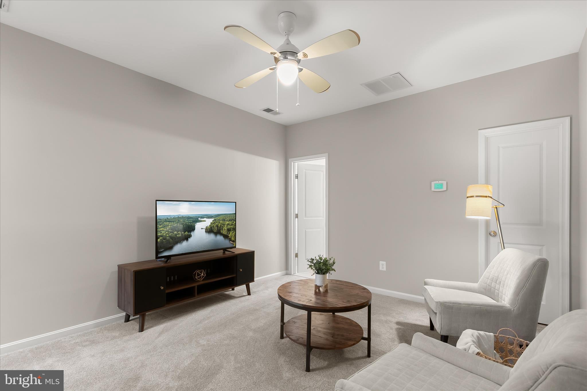 7650 Midtown Road Fulton, MD 20759 - Photo 67 of 76 a living room with furniture and a chandelier