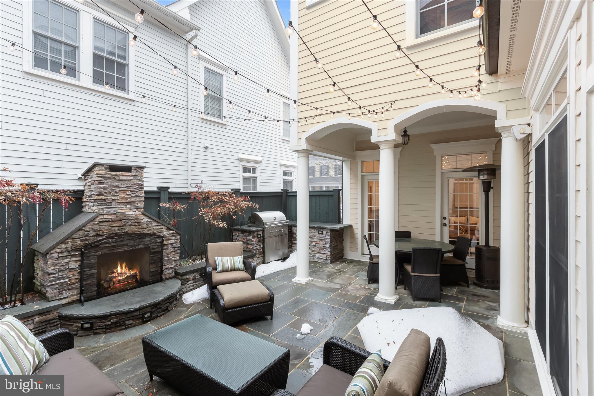 7650 Midtown Road Fulton, MD 20759 - Photo 70 of 76 a view of a patio with couches table and chairs and potted plants