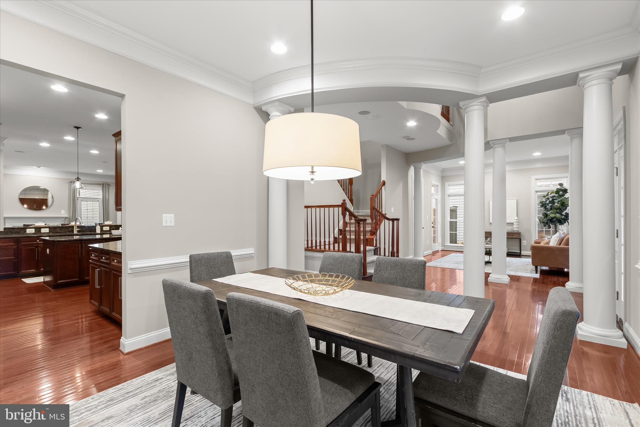 7650 Midtown Road Fulton, MD 20759 - Photo 9 of 76 a dining room with furniture a mirror and wooden floor
