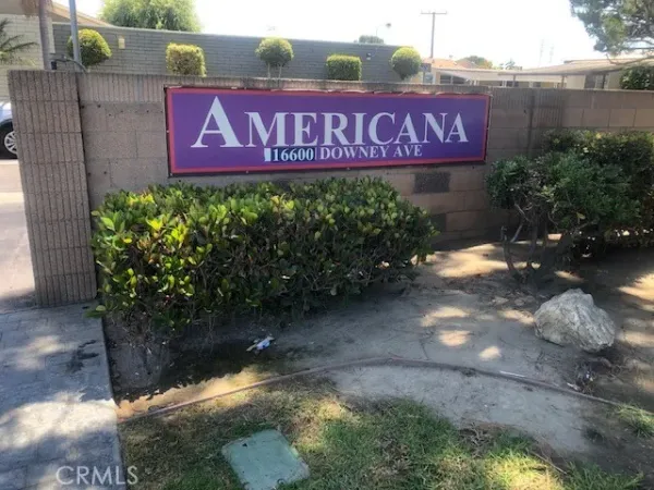 a sign that is on a brick wall