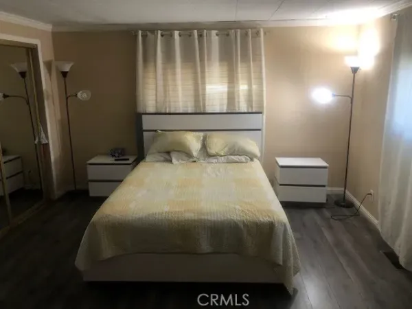 a bedroom with a bed and a table