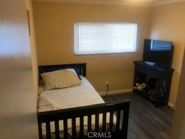 a bedroom with a bed and a fireplace