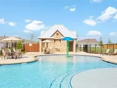 a view of a house with swimming pool