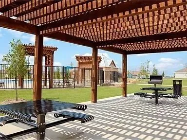 a view of a porch with furniture and garden