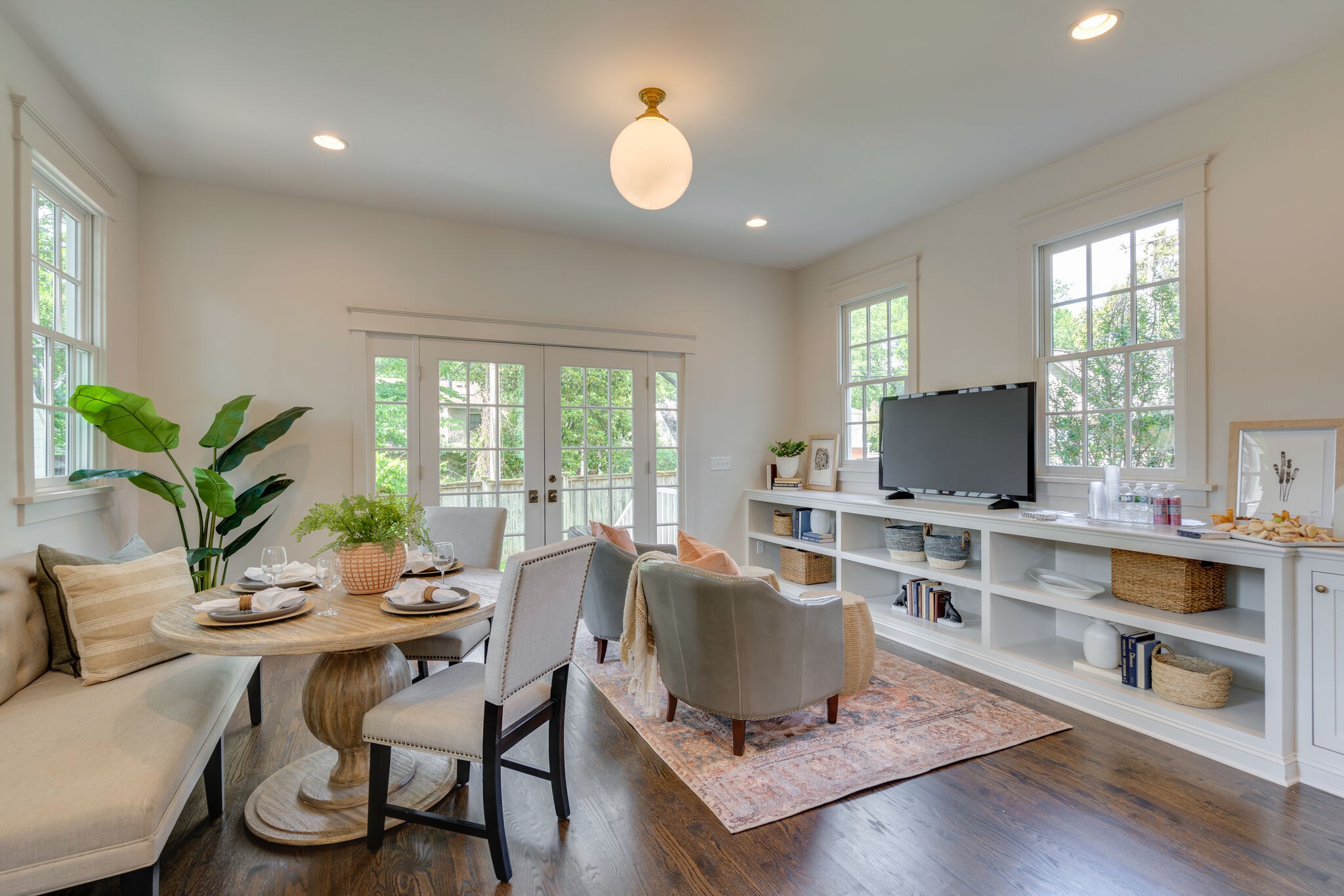 249 Lauderdale Road Nashville, TN 37205 - Photo 22 of 66 a living room with furniture a flat screen tv and a large window