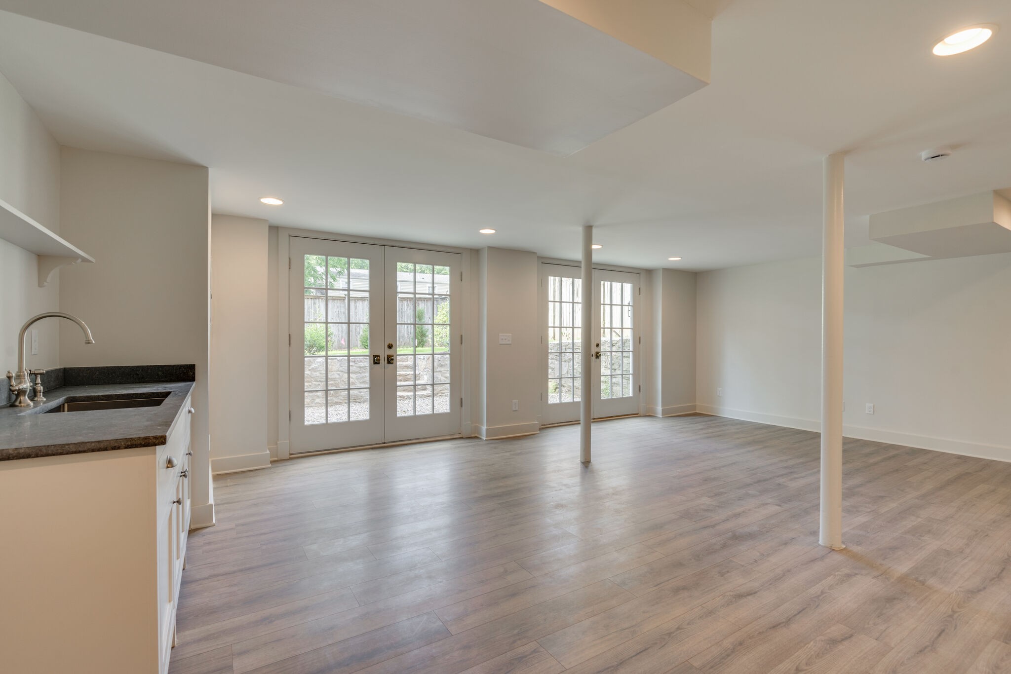 249 Lauderdale Road Nashville, TN 37205 - Photo 49 of 66 a view of an empty room with a window and wooden floor