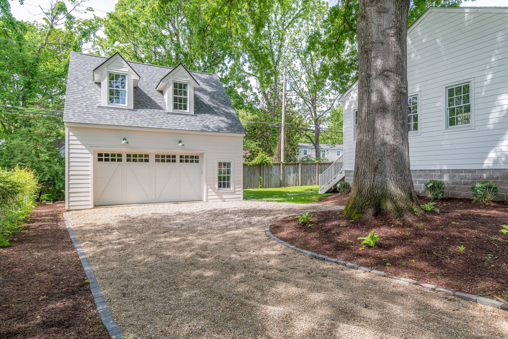 249 Lauderdale Road Nashville, TN 37205 - Photo 66 of 66 a front view of a house with a yard and garage