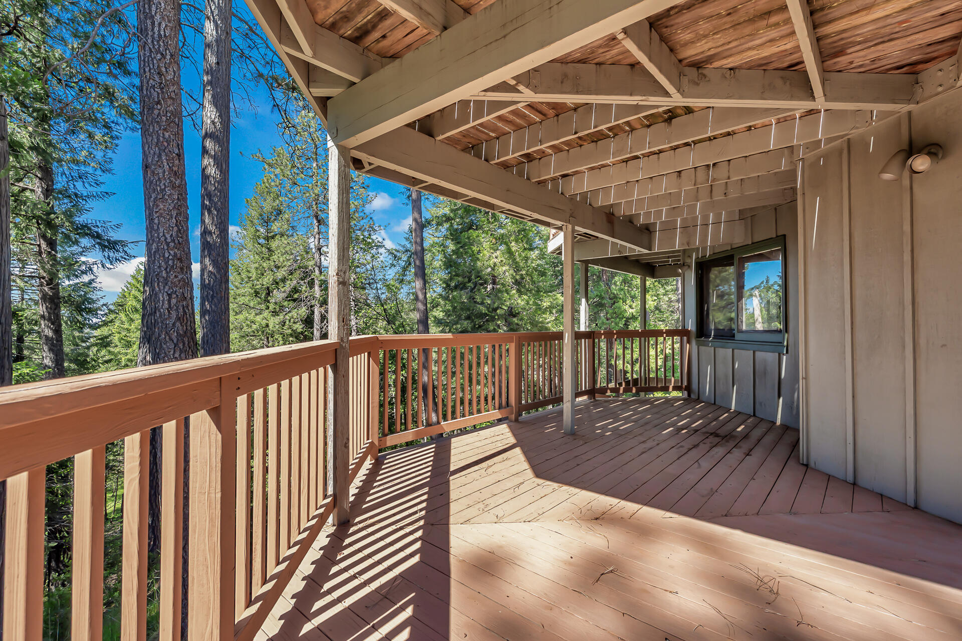 15368 Star Flower Road Oak Run, CA 96069 - Photo 16 of 63 a view of porch with wooden floor in outdoor space