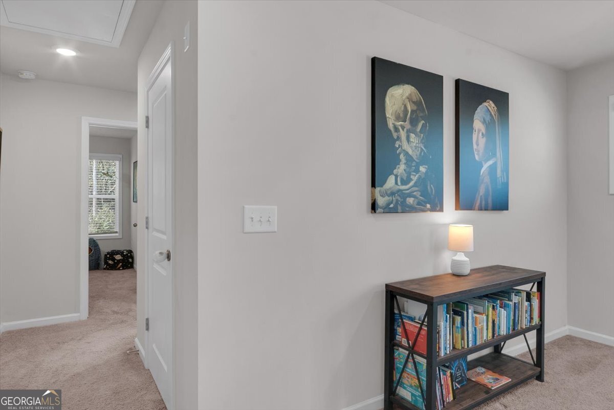 2099 Easterwood Court Decatur, GA 30032 - Photo 14 of 38 a hallway with front door wooden floor and a cabinet