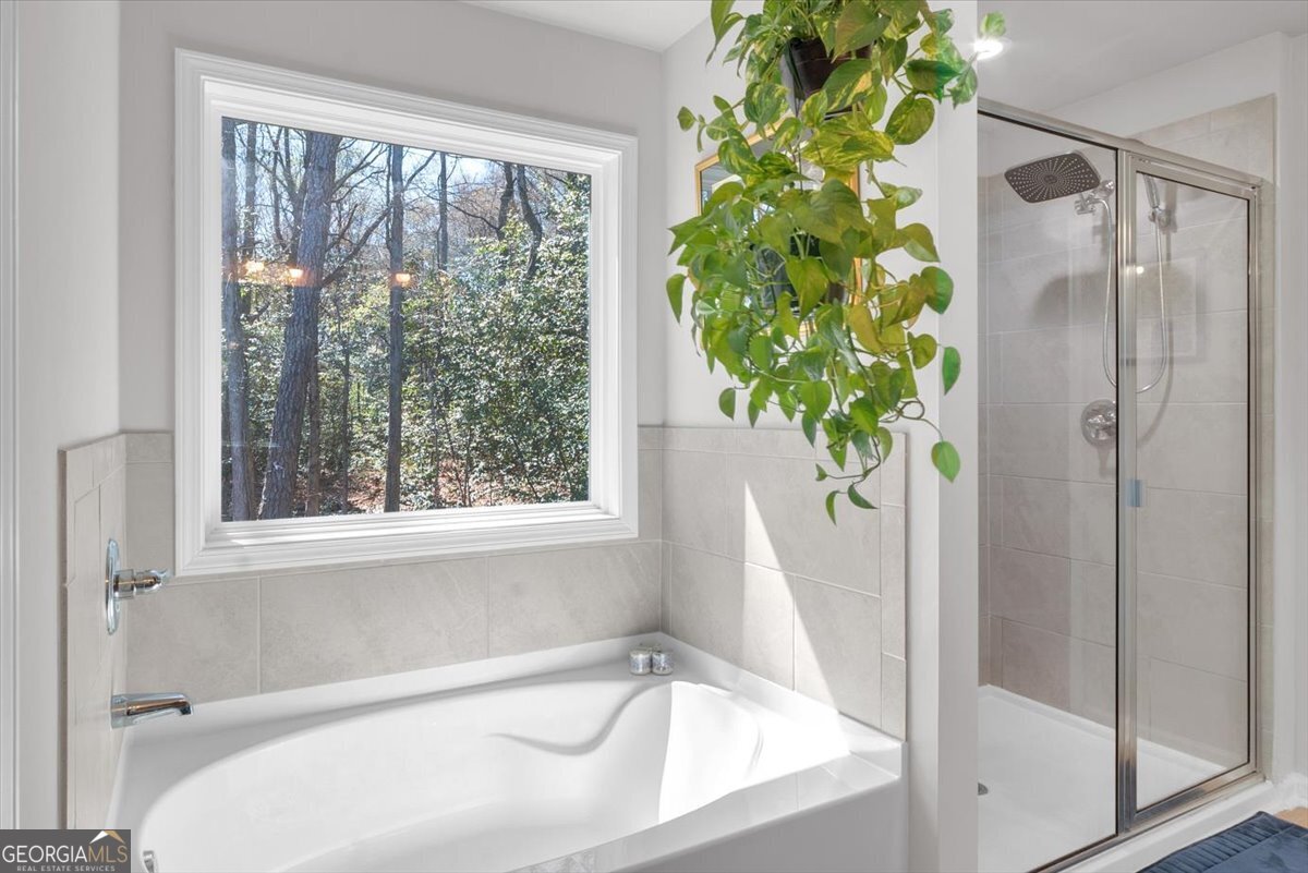 2099 Easterwood Court Decatur, GA 30032 - Photo 17 of 38 a white bath tub with a shower