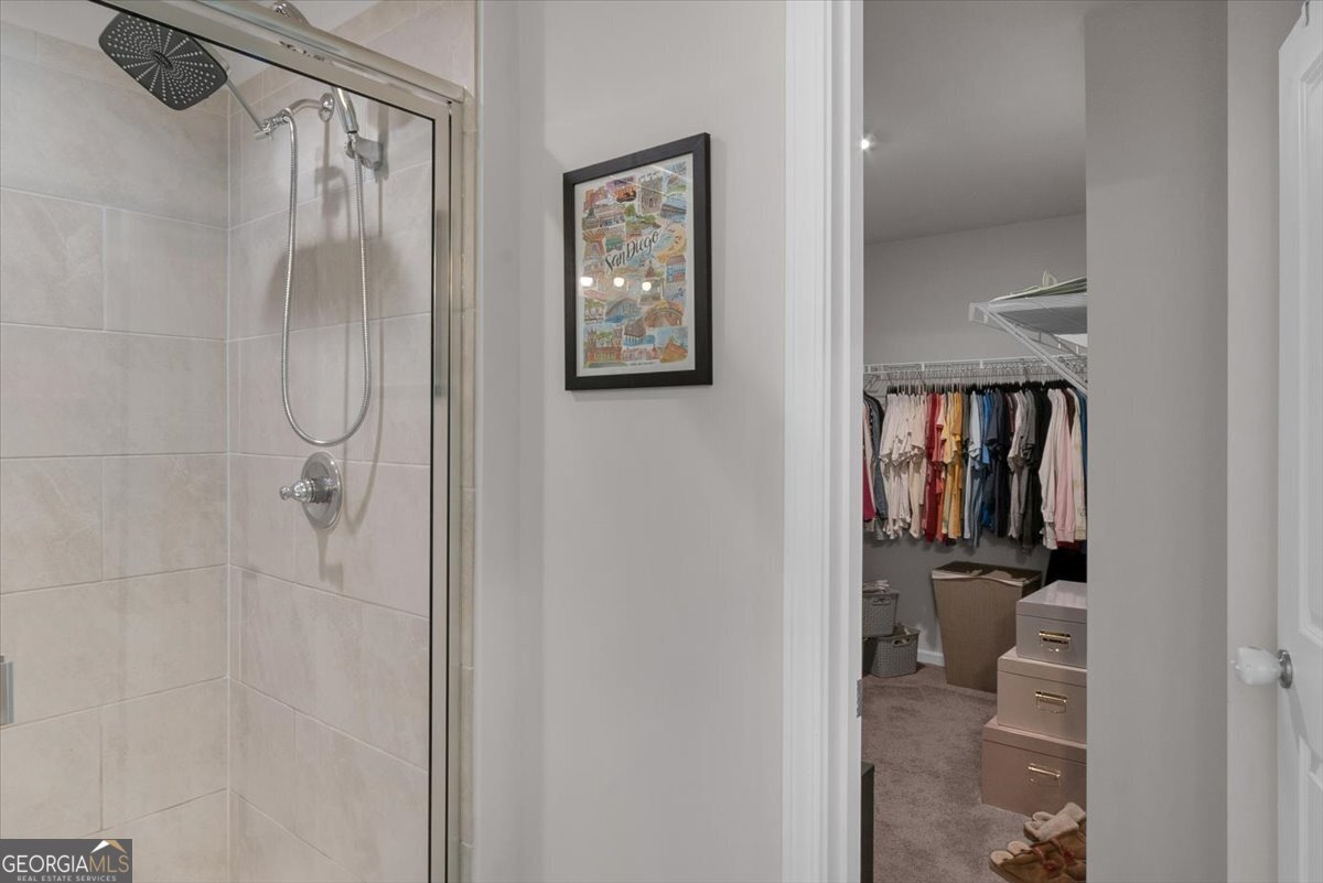 2099 Easterwood Court Decatur, GA 30032 - Photo 19 of 38 a bathroom with a glass shower door
