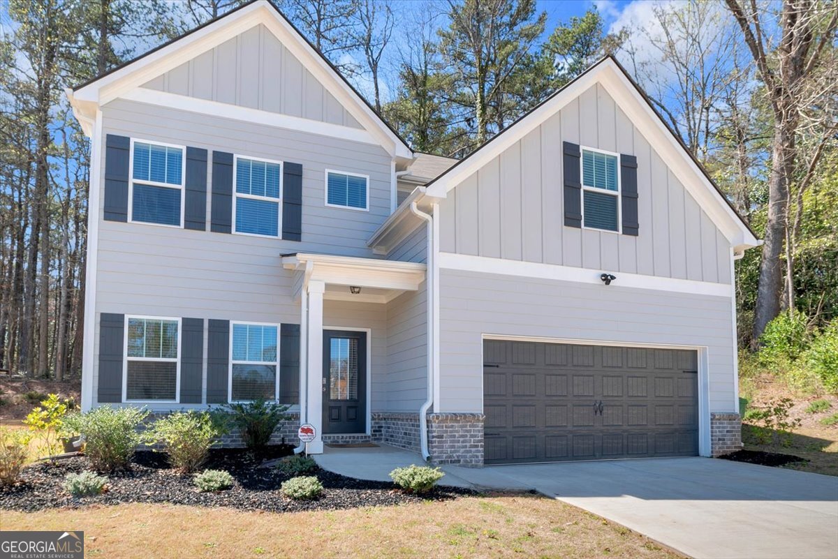 2099 Easterwood Court Decatur, GA 30032 - Photo 2 of 38 a front view of a house with a yard and garage