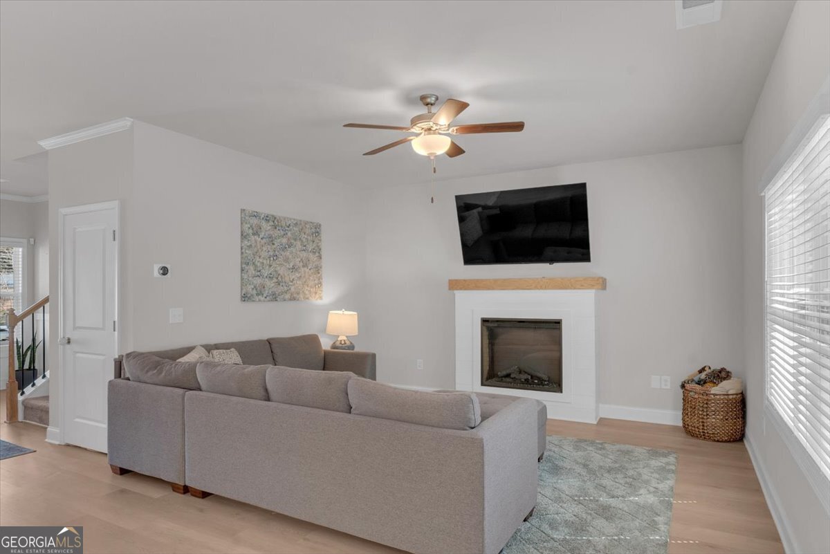 2099 Easterwood Court Decatur, GA 30032 - Photo 9 of 38 a living room with furniture a fireplace and a flat screen tv