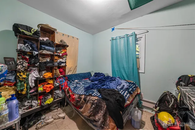 a kitchen with granite countertop a sink stove and cabinets