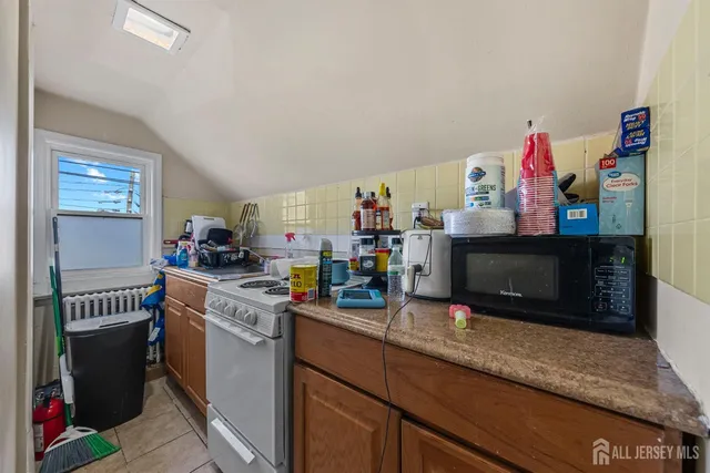 a bathroom with a toilet a sink and a cabinets