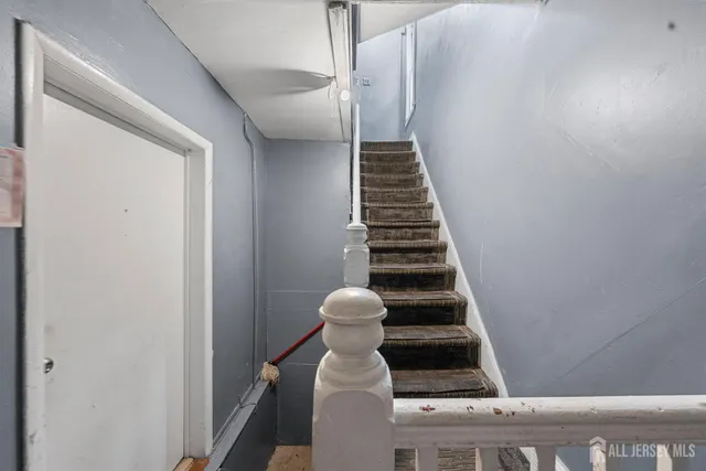 a view of an outdoor dining space with wooden floor