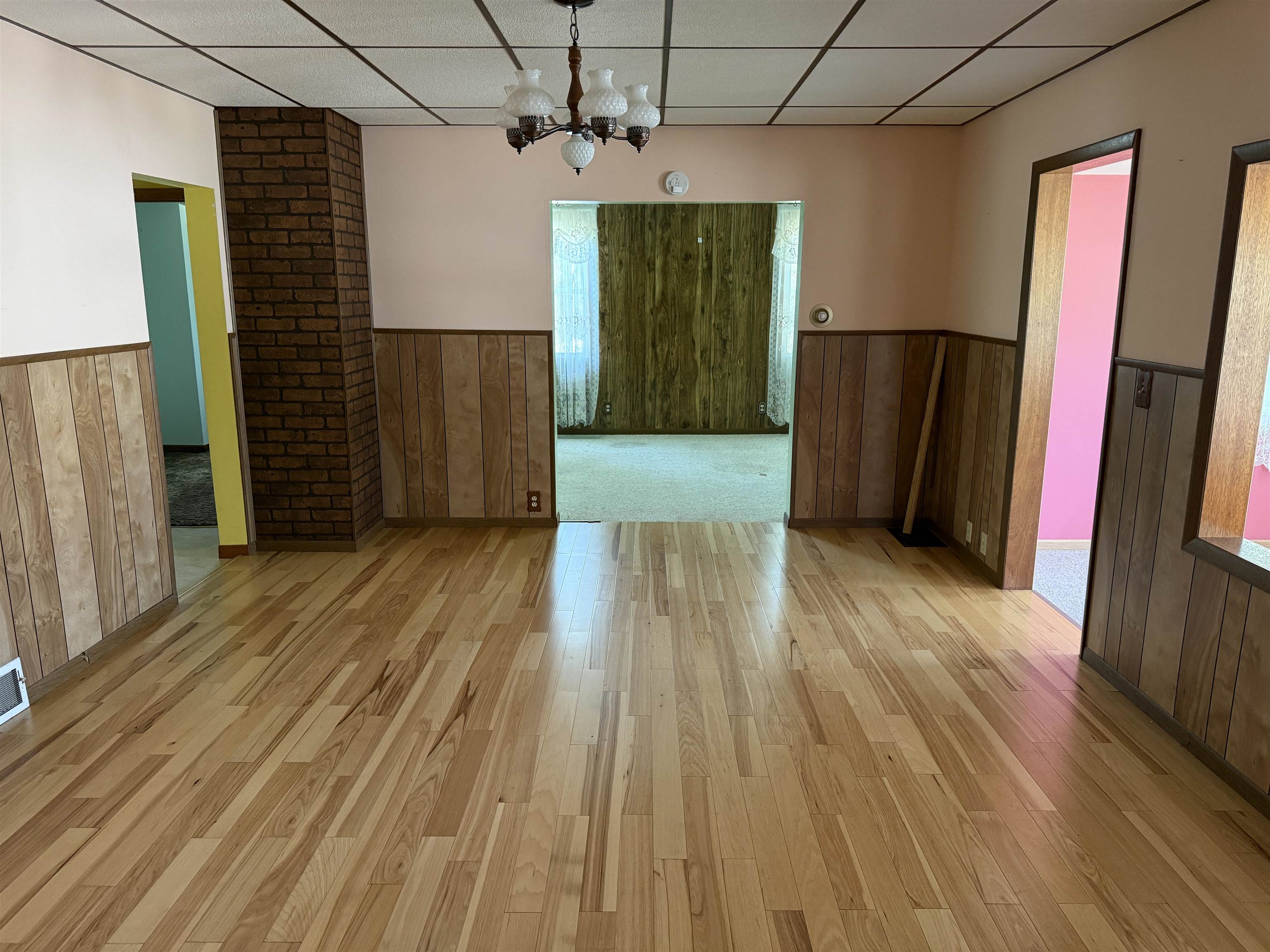 3018 West Beaver Road Freeport, IL 61032 - Photo 7 of 26 a view of a hallway with wooden floors and stairs