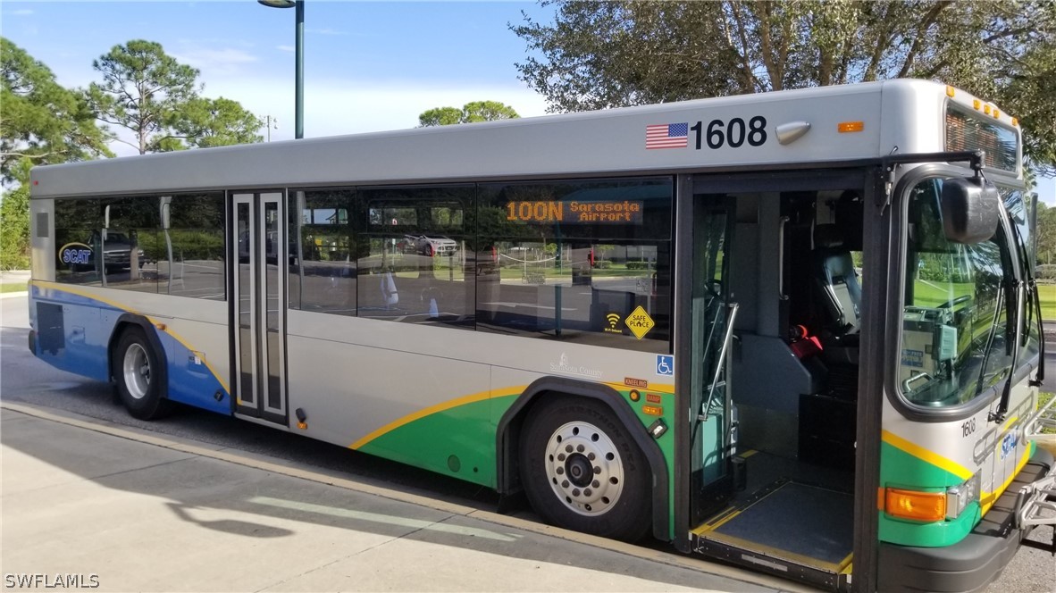 971128607 Embassy Road North Port, FL 34291 - Photo 27 of 43 a view of a car park with porch